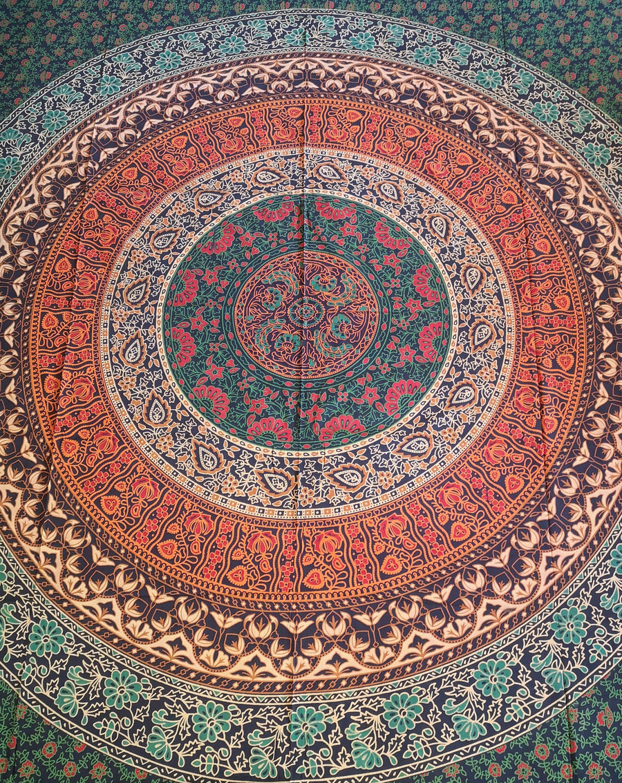 primarily green and orange tapestry with circles and flowers, slightly closer view