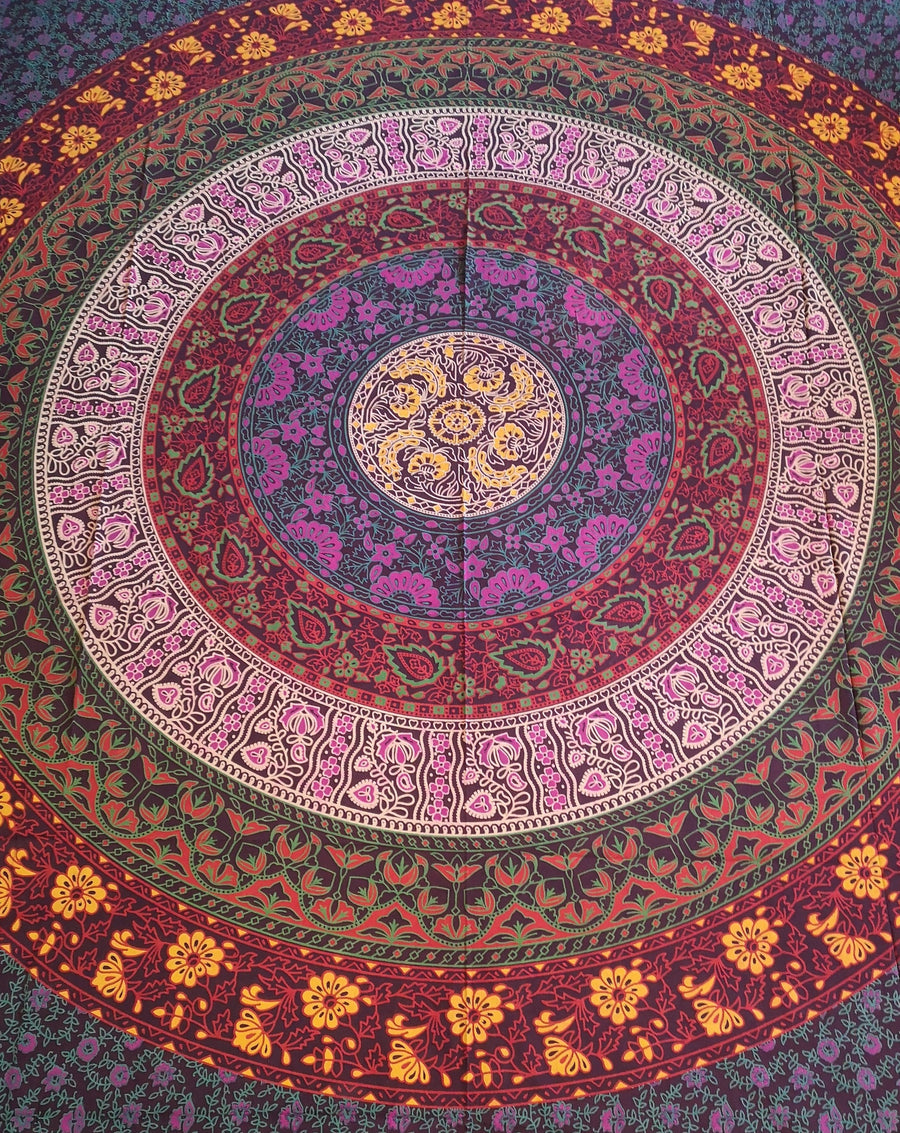 Red purple yellow pink magenta tapestry with circles and flowers, slightly closer